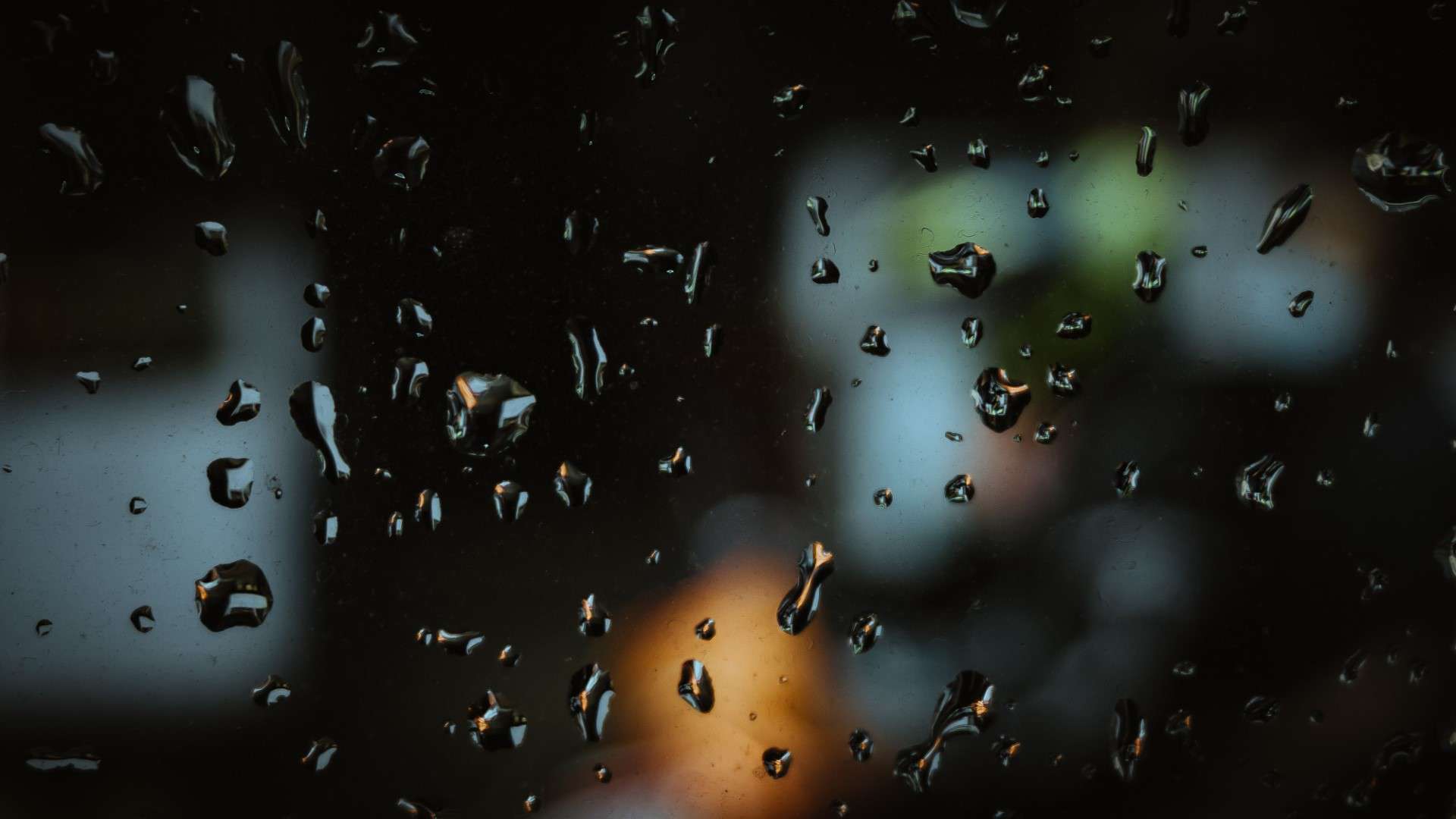 rain droplets running down a window Large bronze reflective glass window
