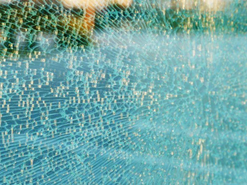 Broken Toughened Glass in office Building. Texture